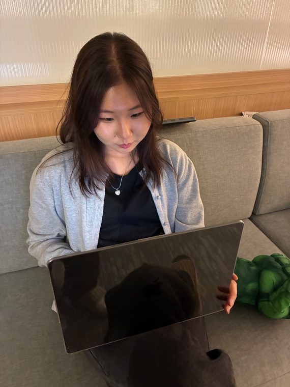 A student works on her laptop