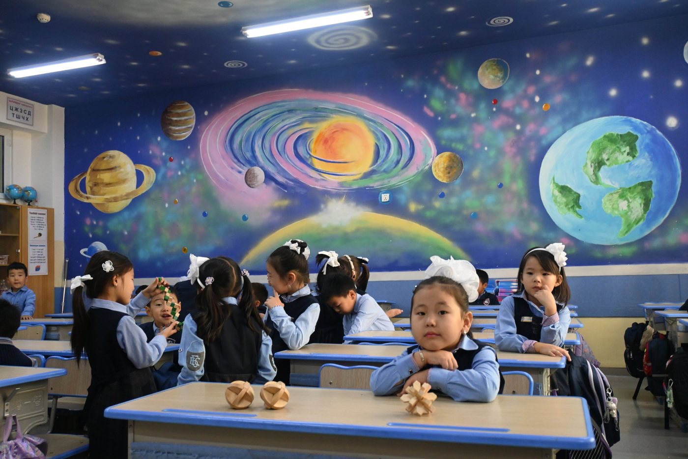 Students working on wooden puzzles at 21st Secondary School of Ulaanbaatar