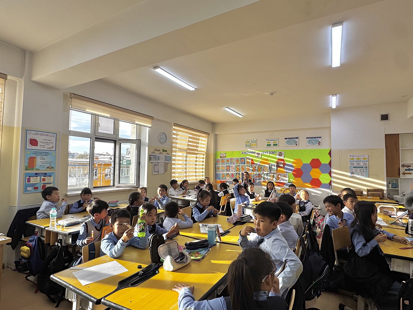 Students working on wooden puzzles at 1st Secondary School of Uvurkhangai